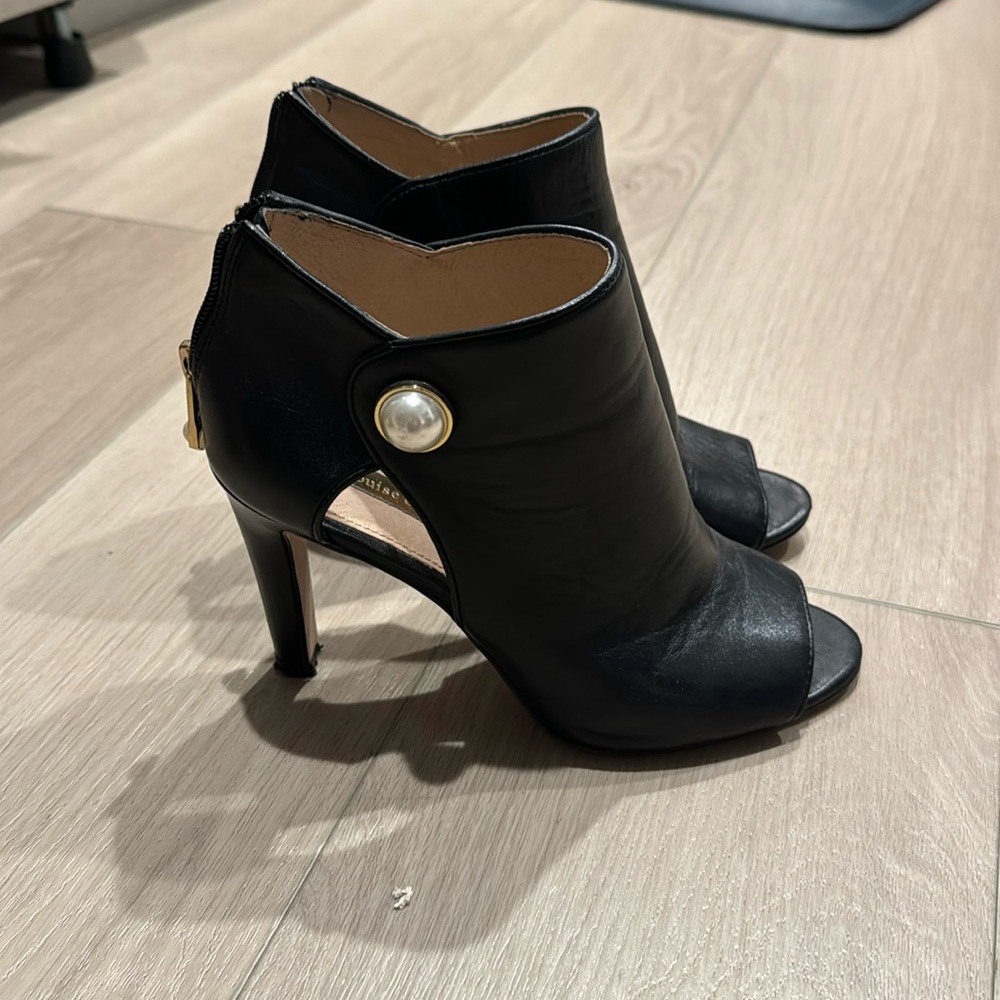 Black open toe booties with gold and pearl accents